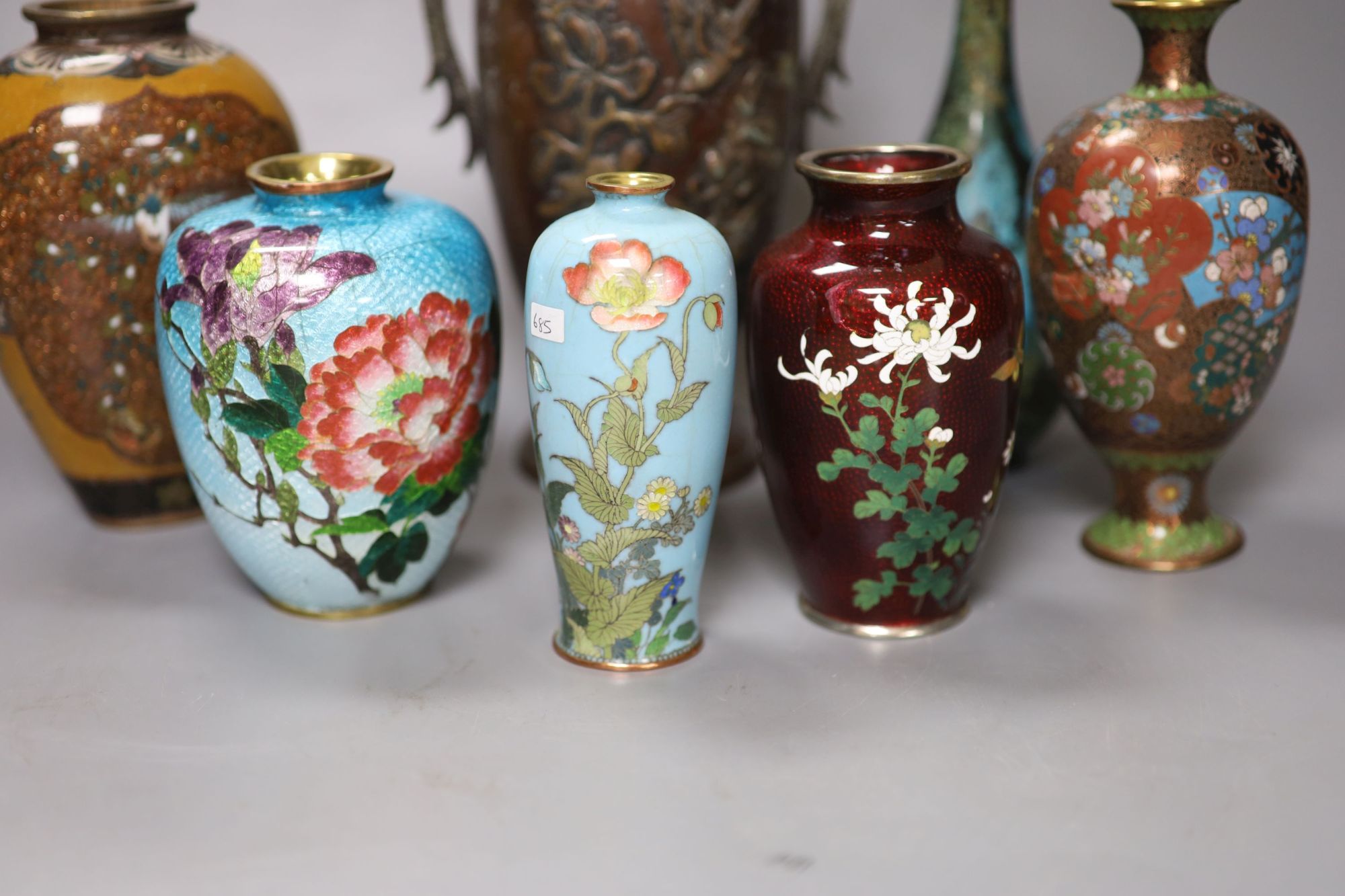 Seven Japanese vases including one bronze, five cloisonne enamel and a patinated bronze bottle vase, tallest 22cm